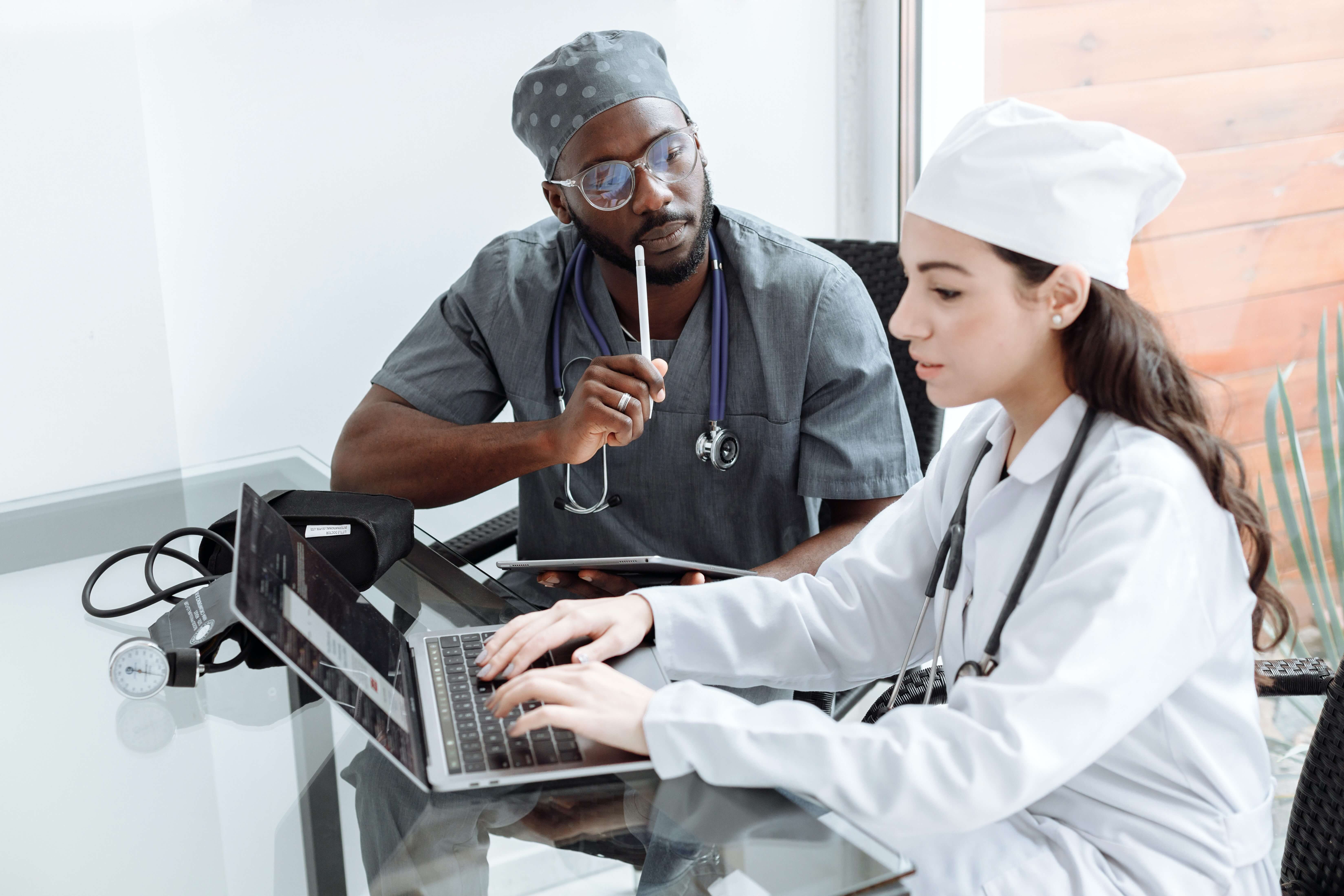 Image of two providers meeting to discuss a patient